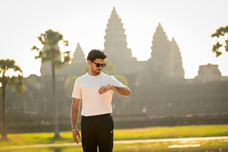 Man photographed in front of Angkor Wat temple